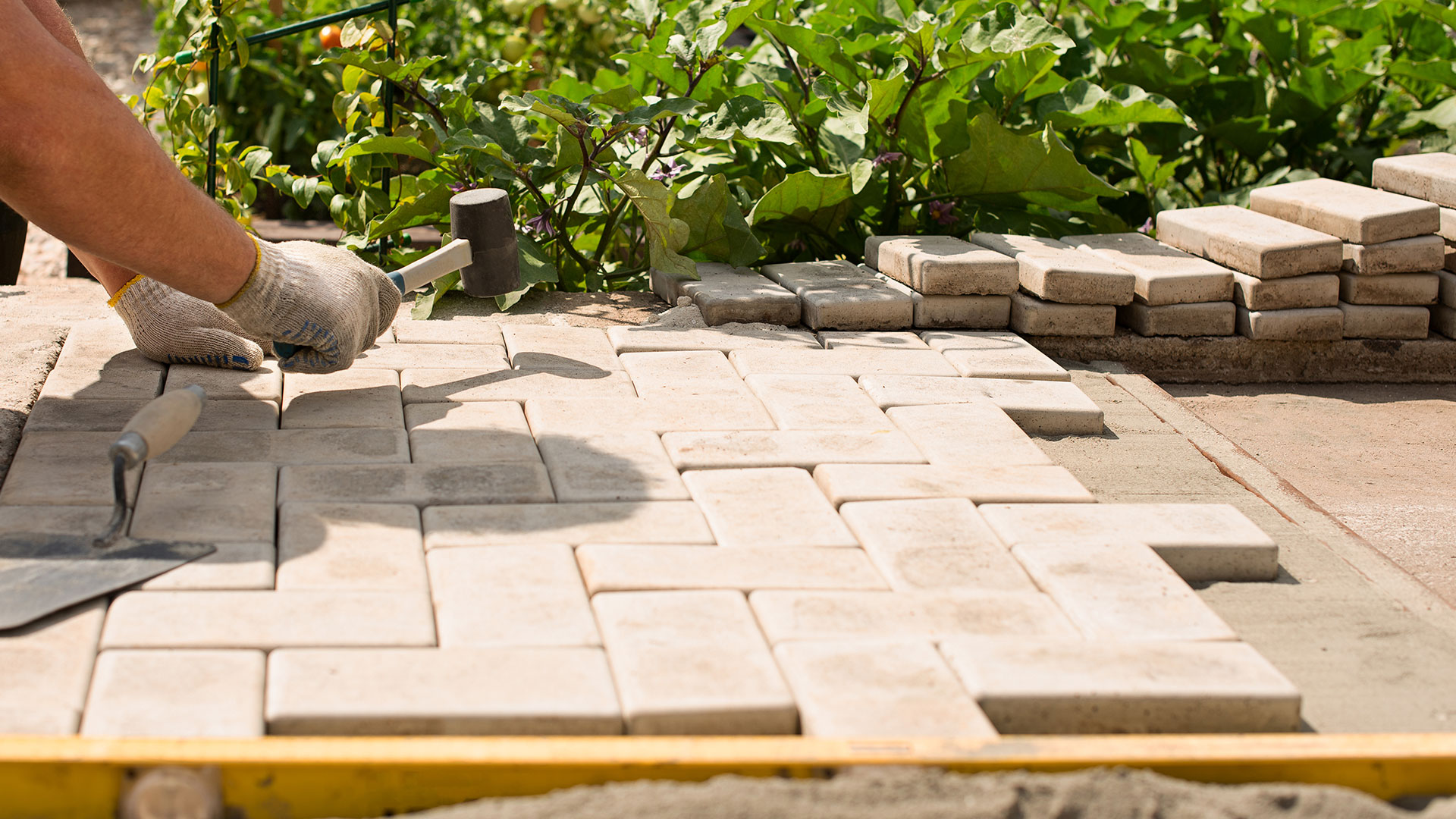  Our skilled team installs flagstone patios, block paving, and natural stone pathways that are both durable and visually striking.
